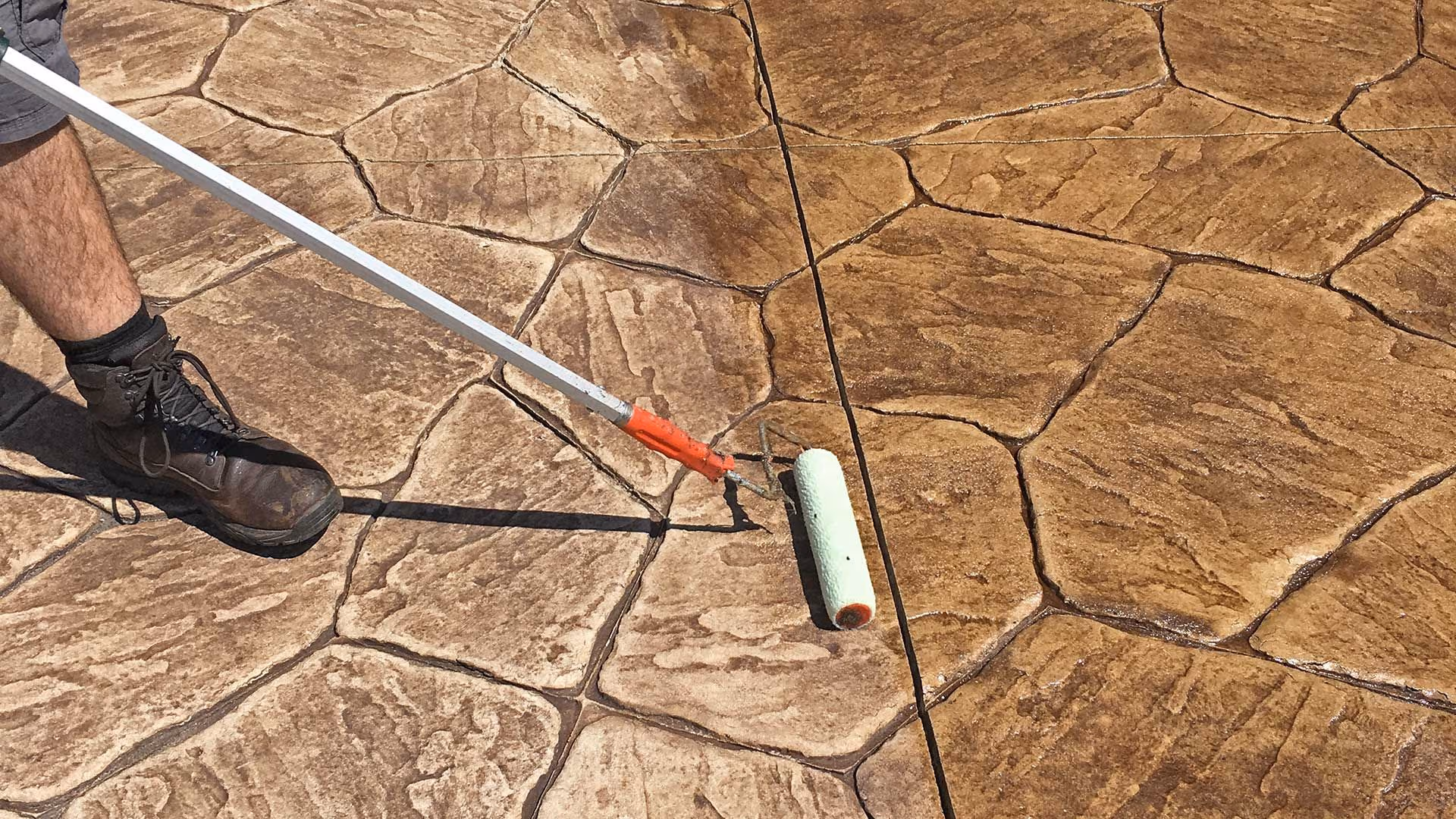 Stamped concrete being sealed